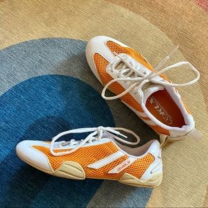 Orange and white tennis shoes